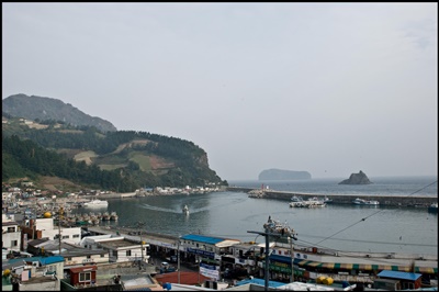 Jeodong Harbour in foreground with Buk Jeo Rock and Jukdo Island in the background to the Northeast