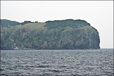 The treacherous cliffs of Jukdo Islet's West shore. (Note spiral cement staircase}.